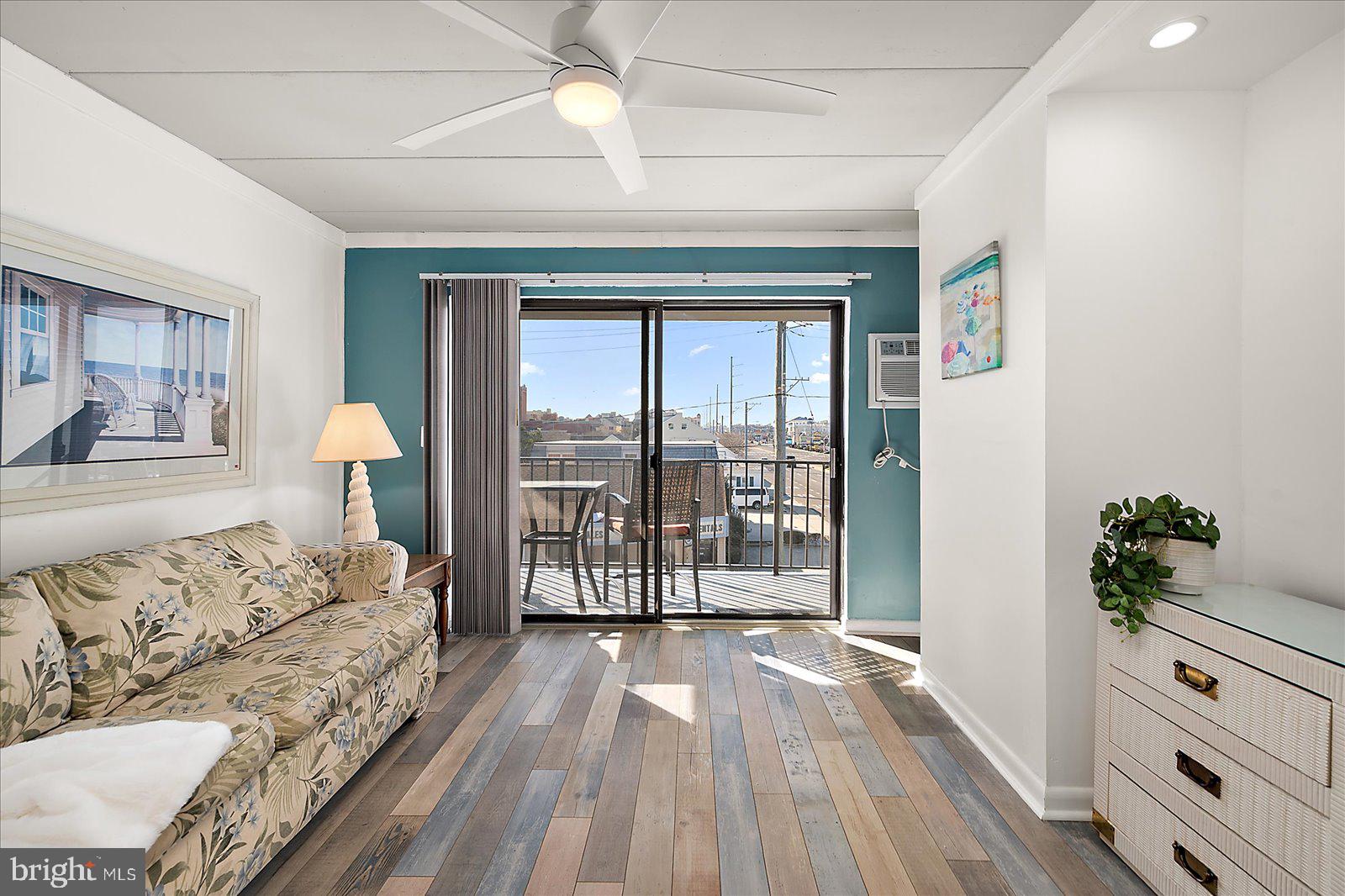 18 69th Street, Unit 9 Ocean City, MD 21842 - Photo 4 of 60 a spacious bedroom with a bed and large window