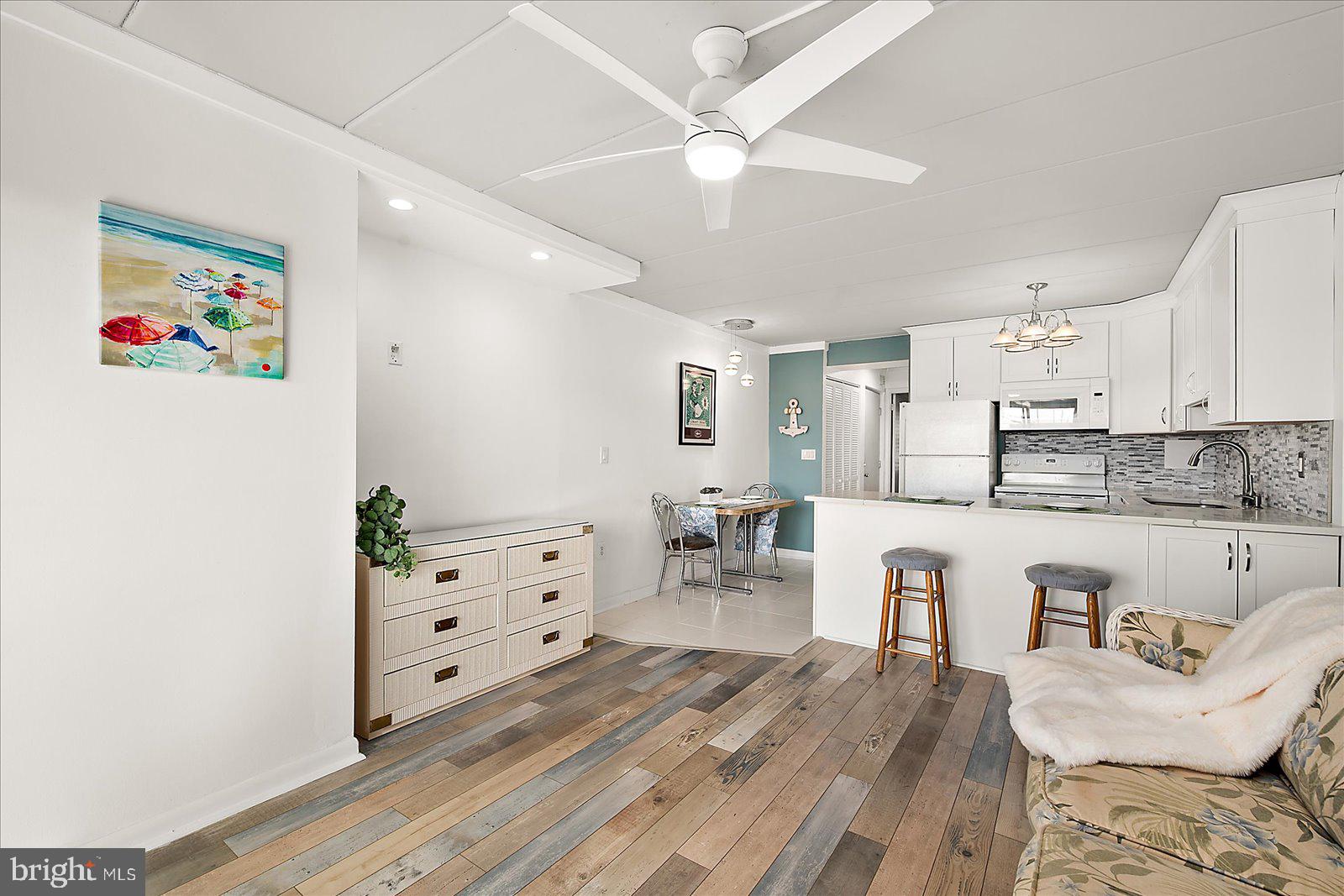 18 69th Street, Unit 9 Ocean City, MD 21842 - Photo 8 of 60 a living room with furniture and wooden floor