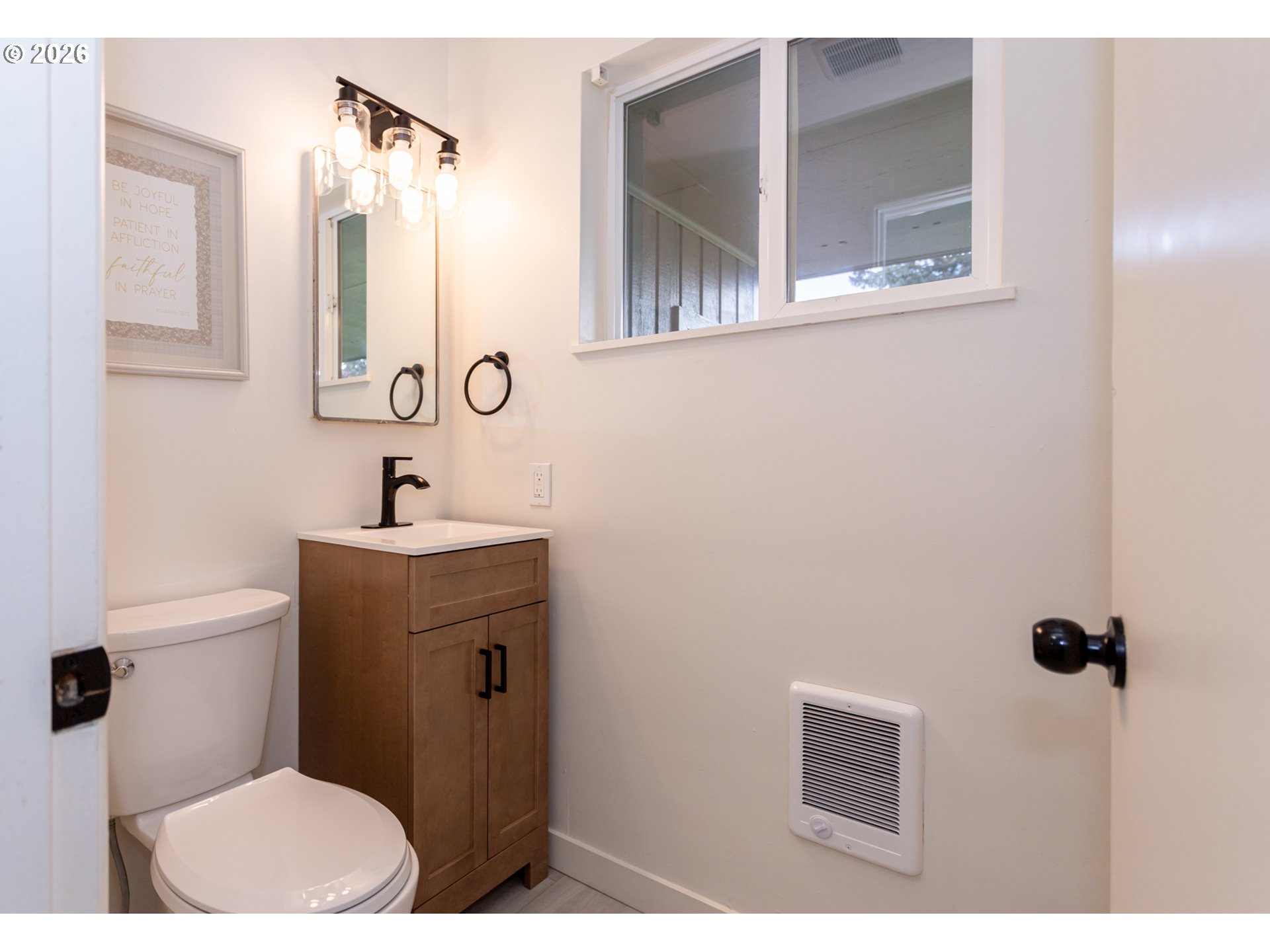 675 Hughes Street Eugene, OR 97402 - Photo 14 of 40 a bathroom with a sink and mirror with toilet