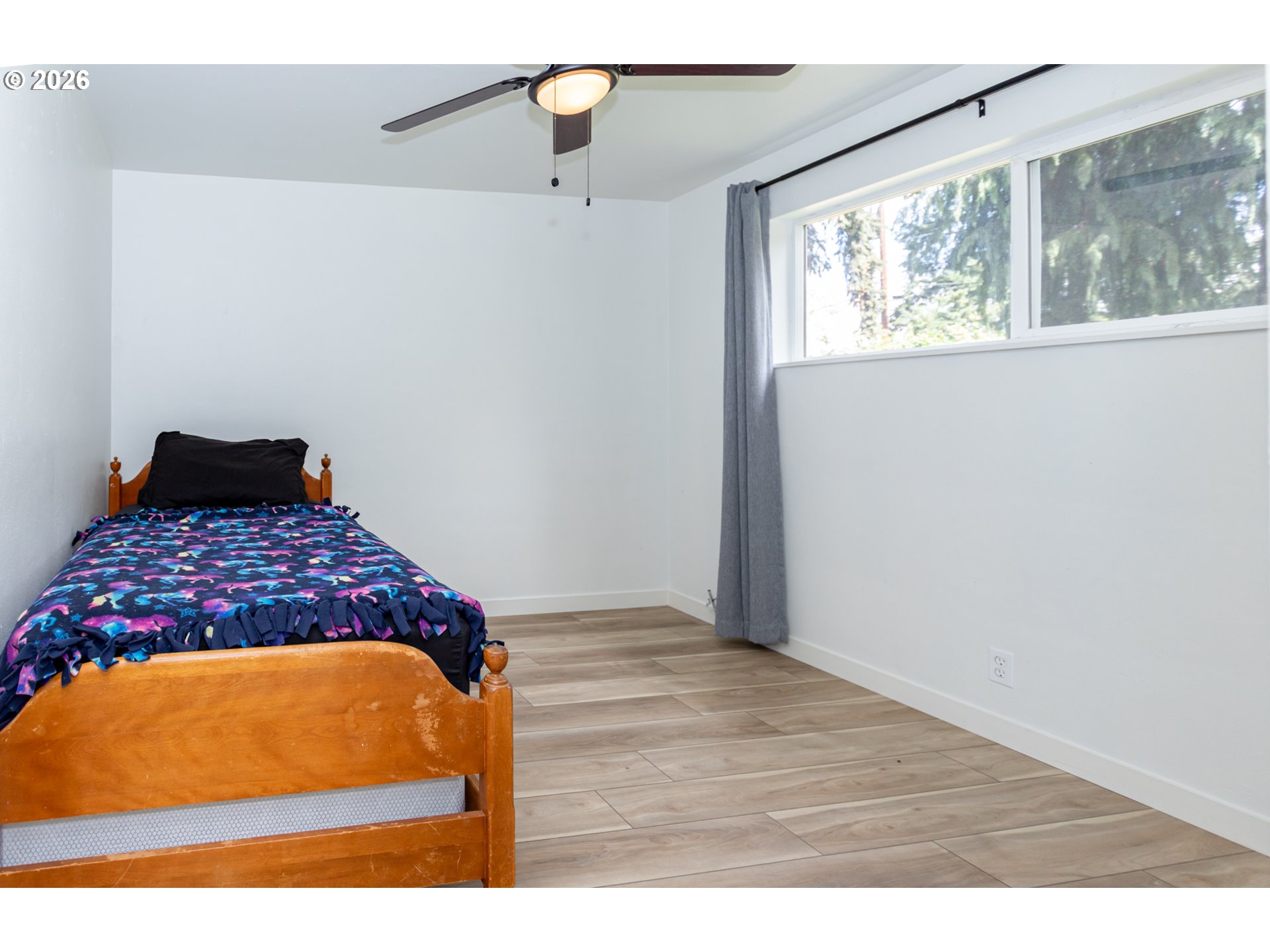 675 Hughes Street Eugene, OR 97402 - Photo 19 of 40 a bedroom with a bed and a window