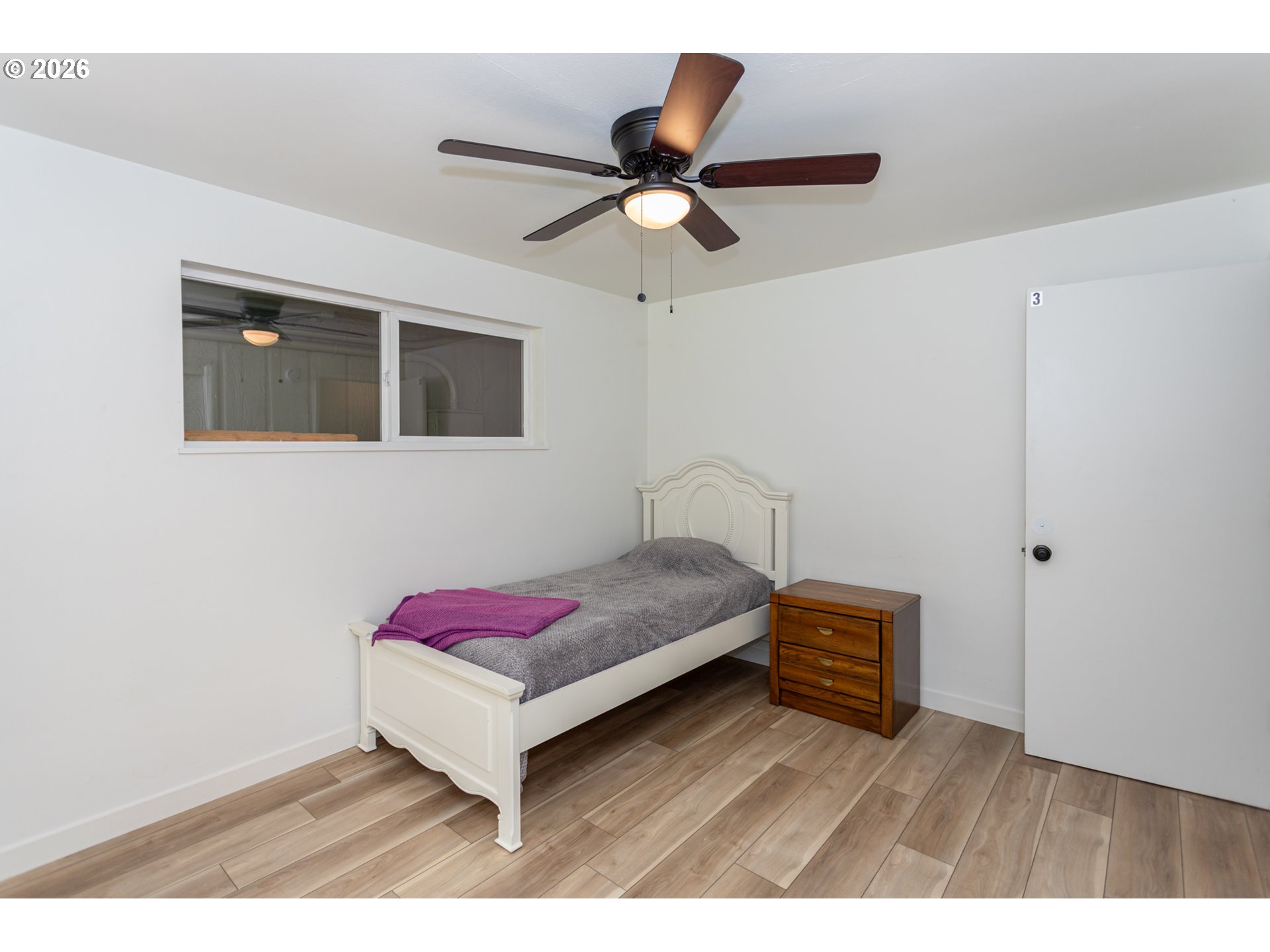 675 Hughes Street Eugene, OR 97402 - Photo 21 of 40 a bedroom with a bed and a ceiling fan
