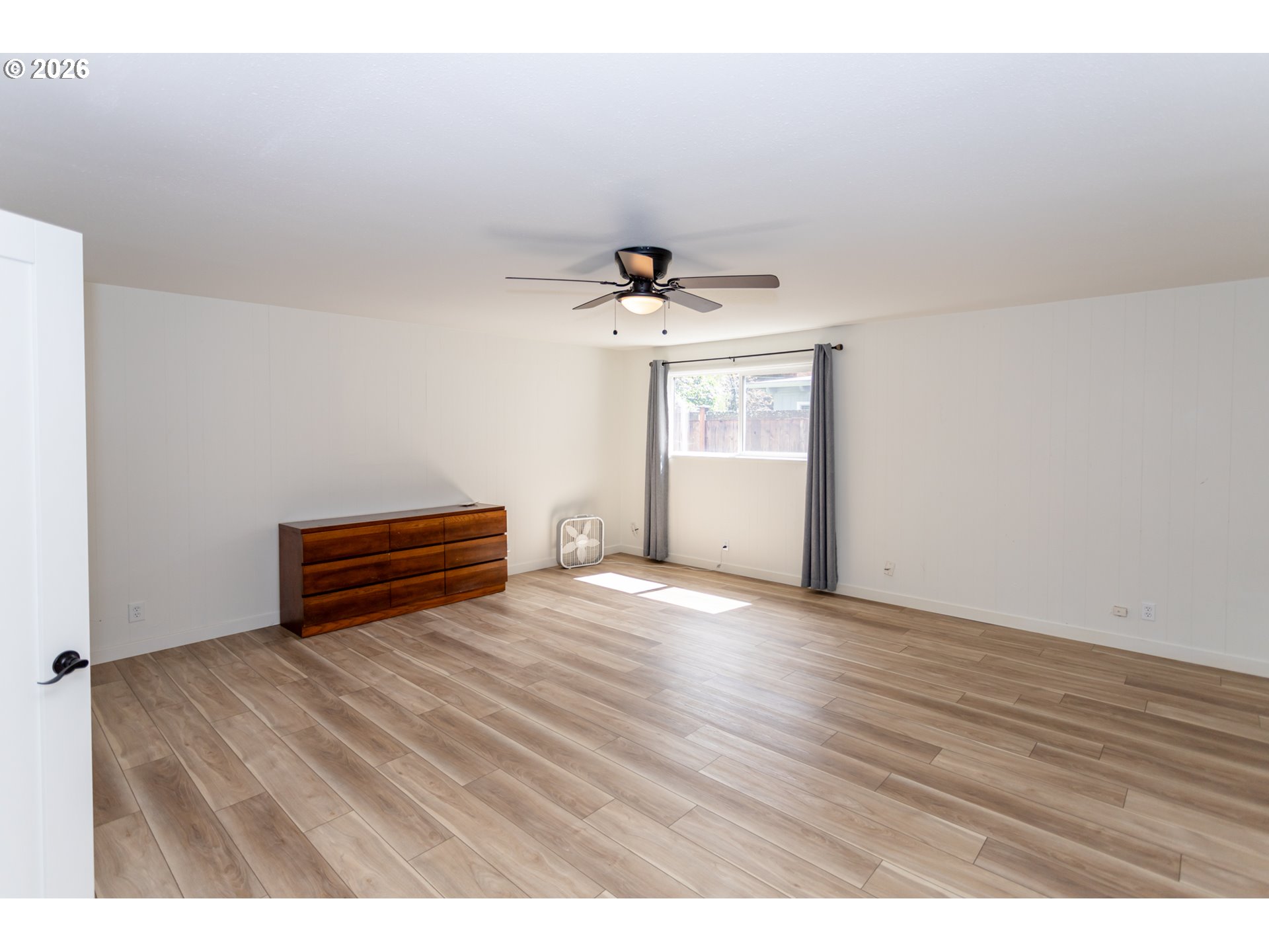 675 Hughes Street Eugene, OR 97402 - Photo 25 of 40 a view of room with wooden floor and window