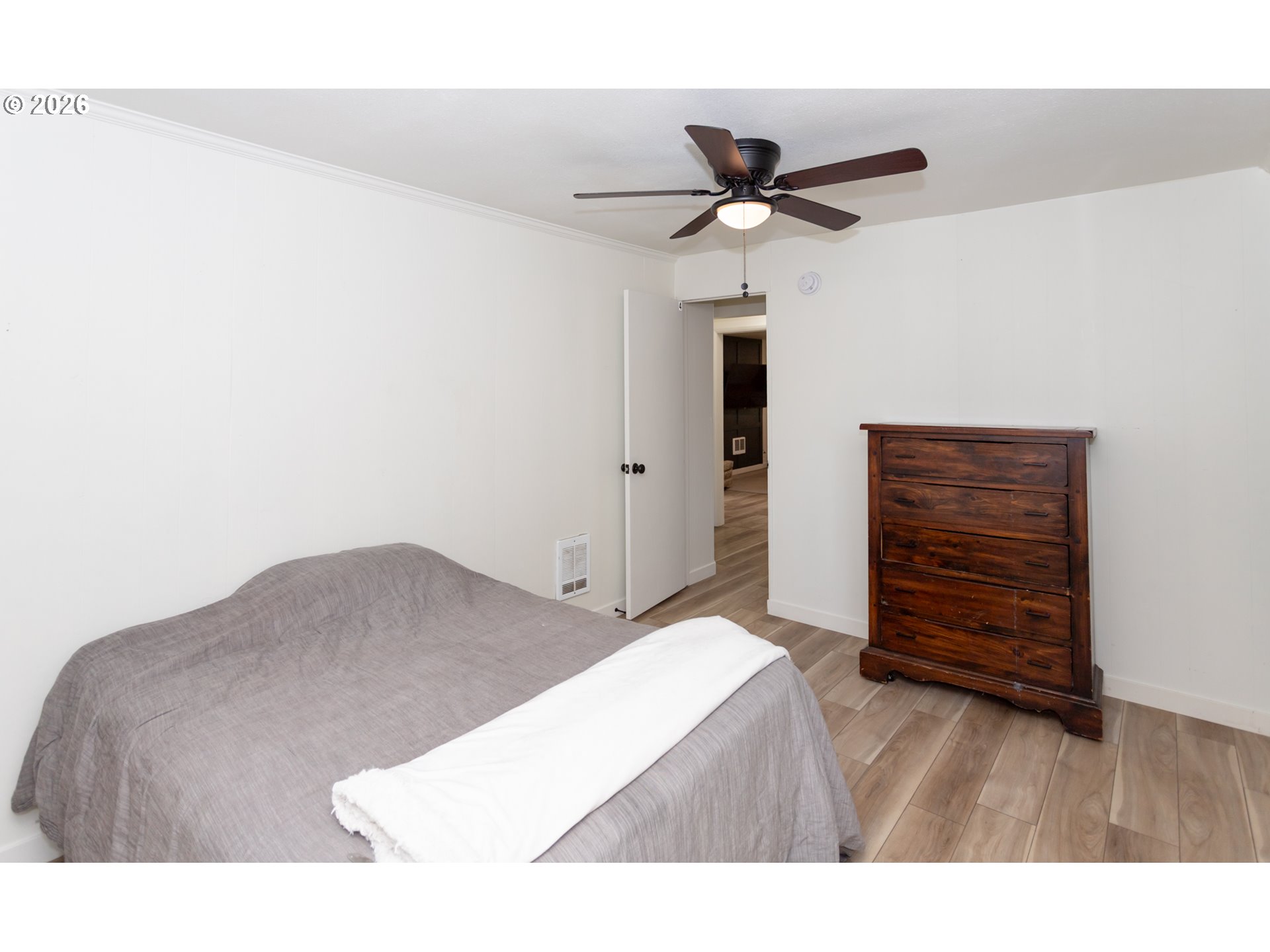 675 Hughes Street Eugene, OR 97402 - Photo 32 of 40 a bedroom with a bed and a dresser