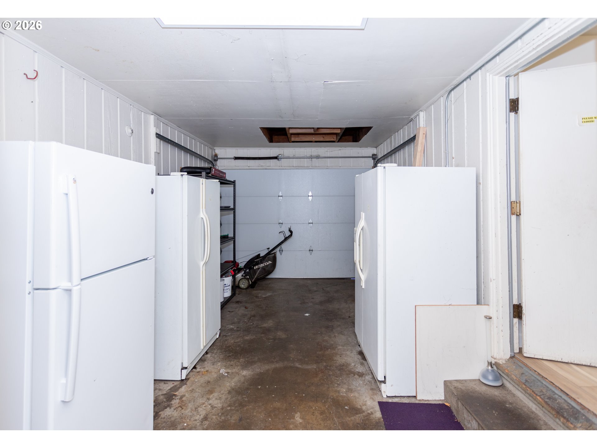 675 Hughes Street Eugene, OR 97402 - Photo 35 of 40 a view of a refrigerator in kitchen and wooden floor