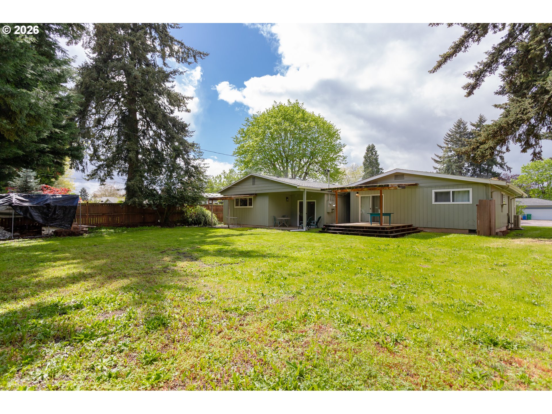 675 Hughes Street Eugene, OR 97402 - Photo 40 of 40 a front view of house with yard and trees in the background