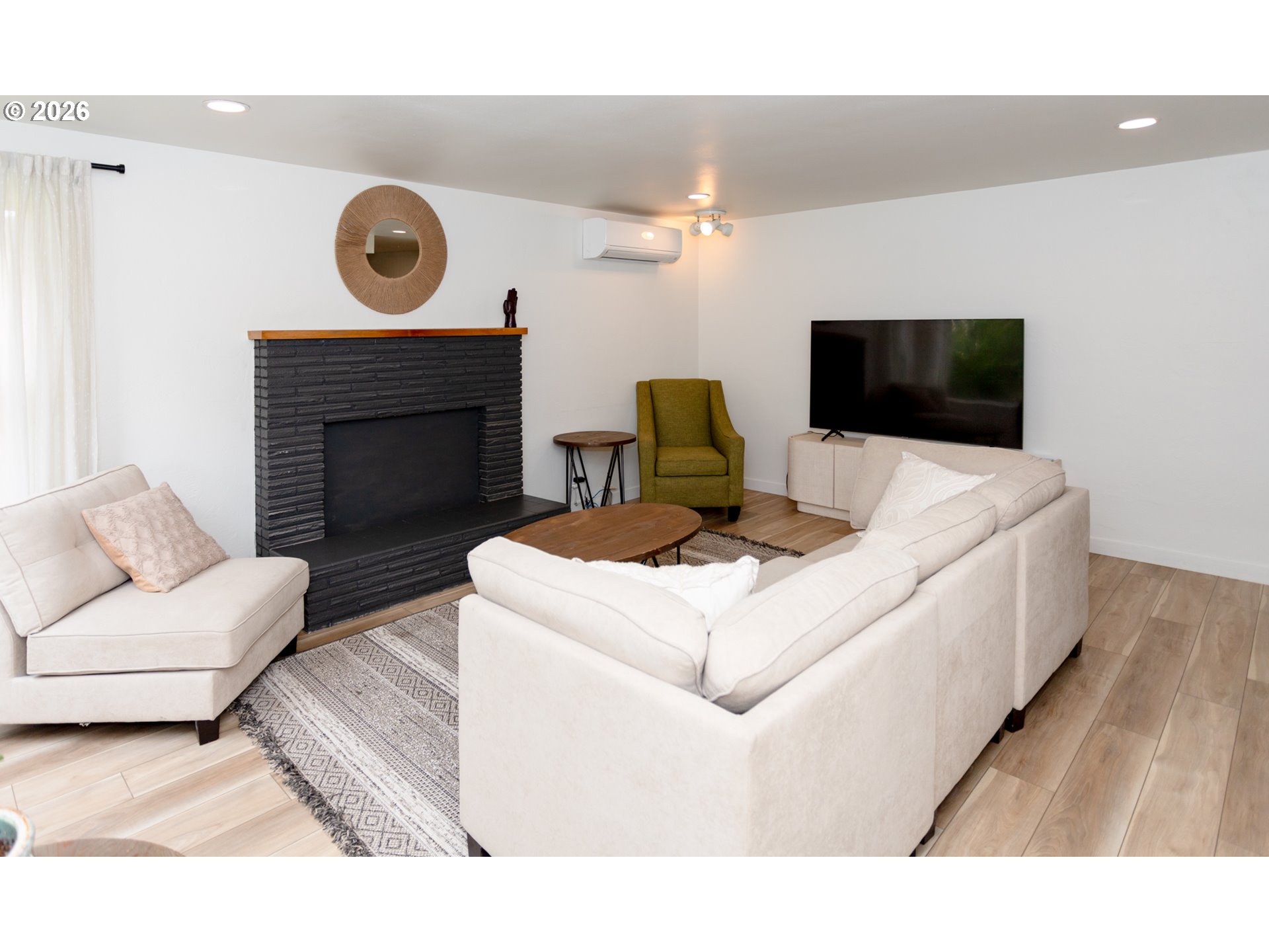675 Hughes Street Eugene, OR 97402 - Photo 4 of 40 a living room with a couch and a fireplace