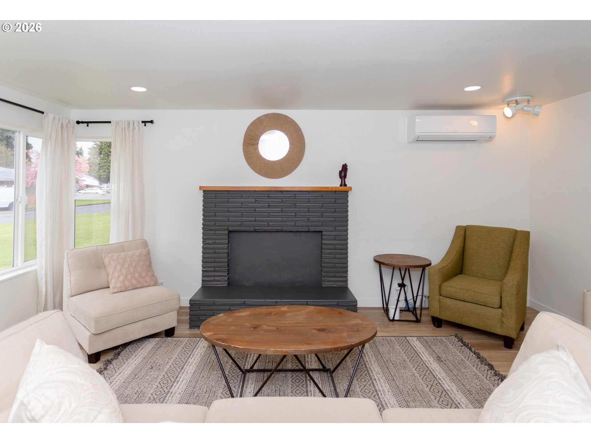 675 Hughes Street Eugene, OR 97402 - Photo 5 of 40 a living room with furniture and a fireplace