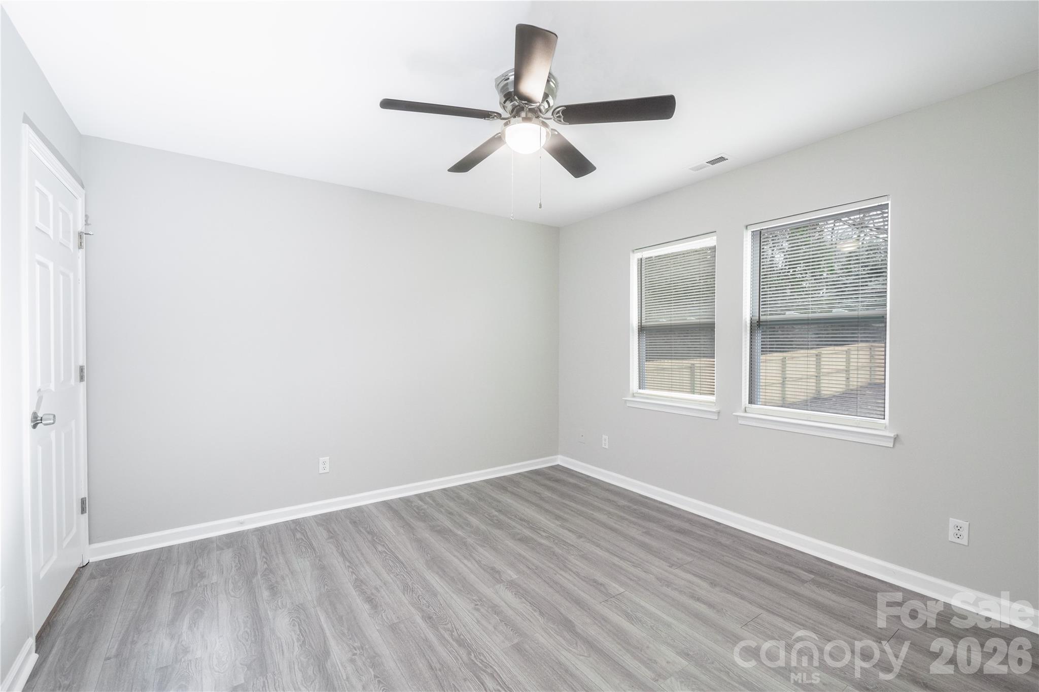 837 Rodey Avenue, Unit 20 Charlotte, NC 28206 - Photo 4 of 12 a view of empty room with wooden floor and fan