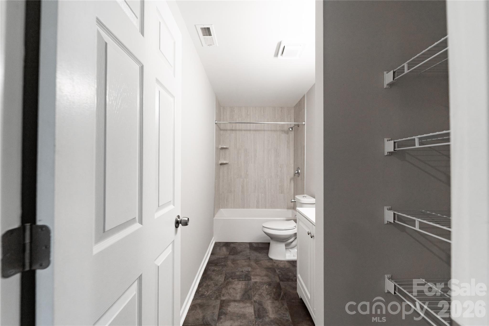 837 Rodey Avenue, Unit 20 Charlotte, NC 28206 - Photo 7 of 12 a bathroom with a toilet and a shower