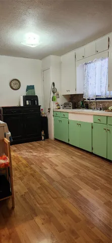 a kitchen with a sink and a stove