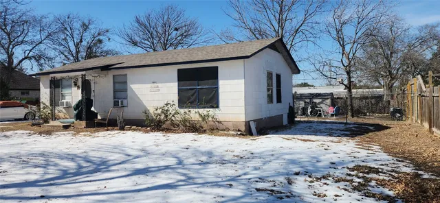 a view of a house covered in snow