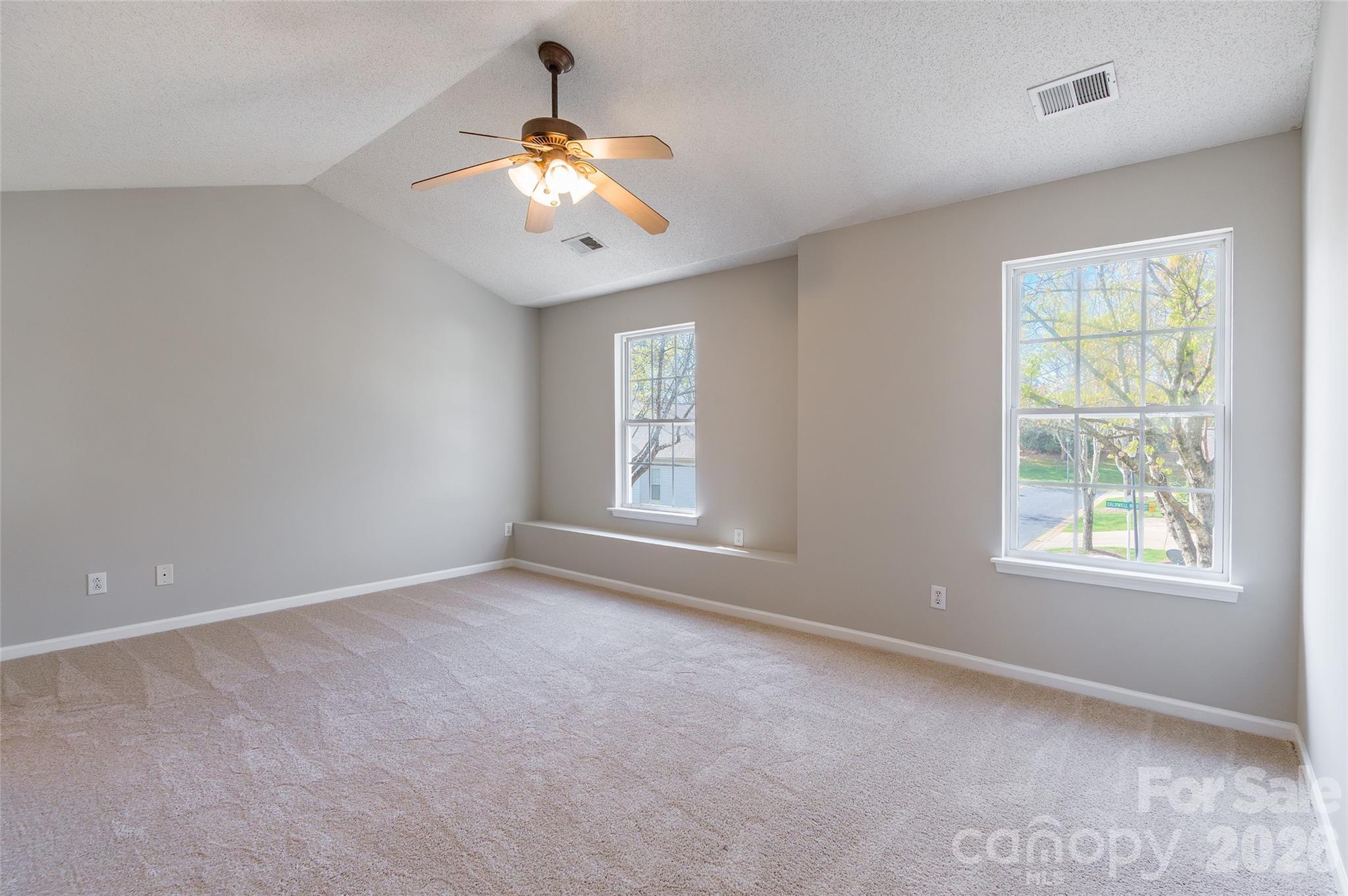 3167 Caldwell Ridge Parkway Charlotte, NC 28213 - Photo 15 of 36 an empty room with windows and fan