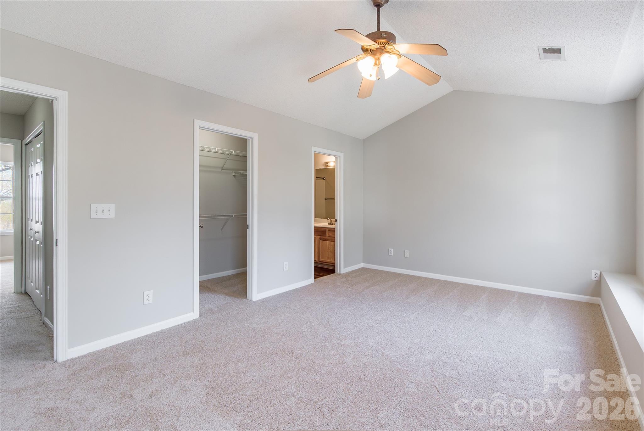 3167 Caldwell Ridge Parkway Charlotte, NC 28213 - Photo 16 of 36 an empty room with closet and a chandelier fan
