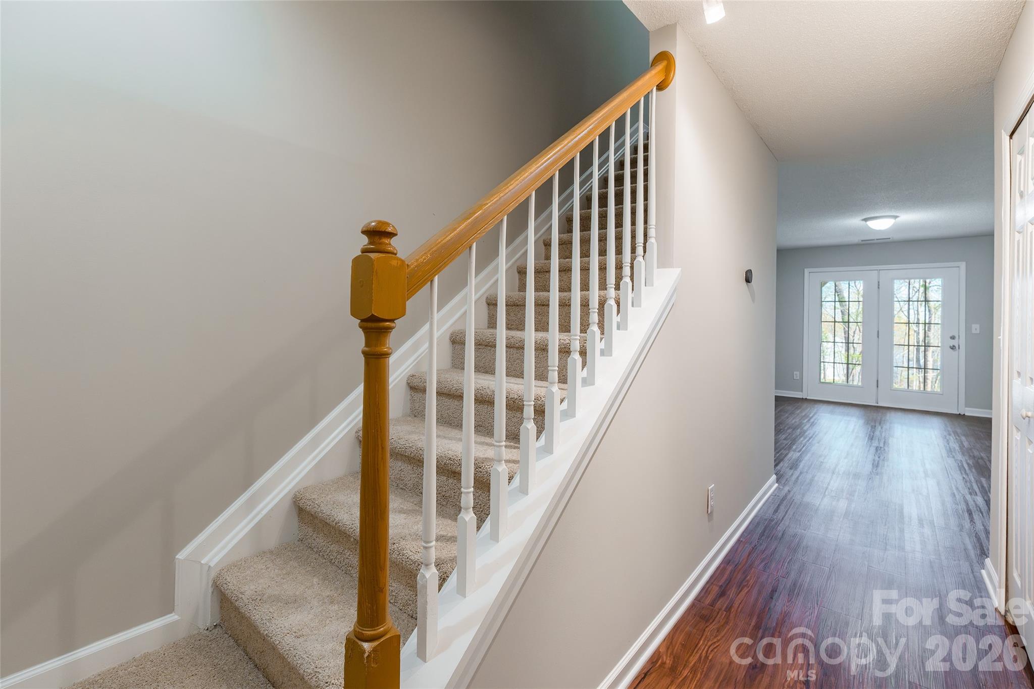 3167 Caldwell Ridge Parkway Charlotte, NC 28213 - Photo 25 of 36 a view of staircase with wooden floor and white walls
