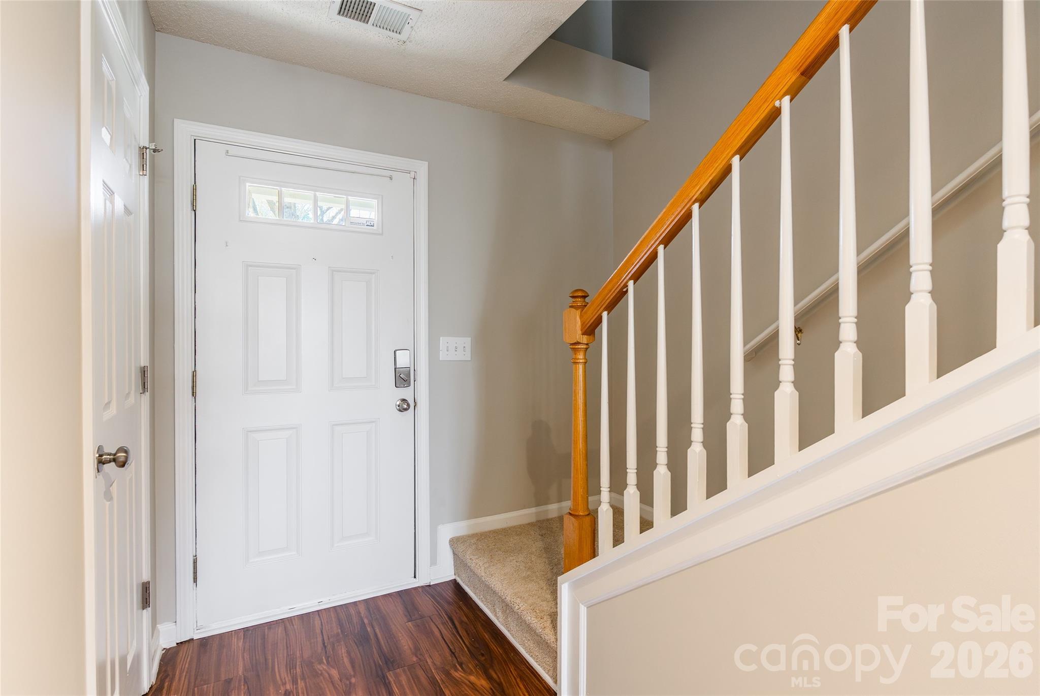 3167 Caldwell Ridge Parkway Charlotte, NC 28213 - Photo 35 of 36 a view of a hallway with wooden floor and entryway