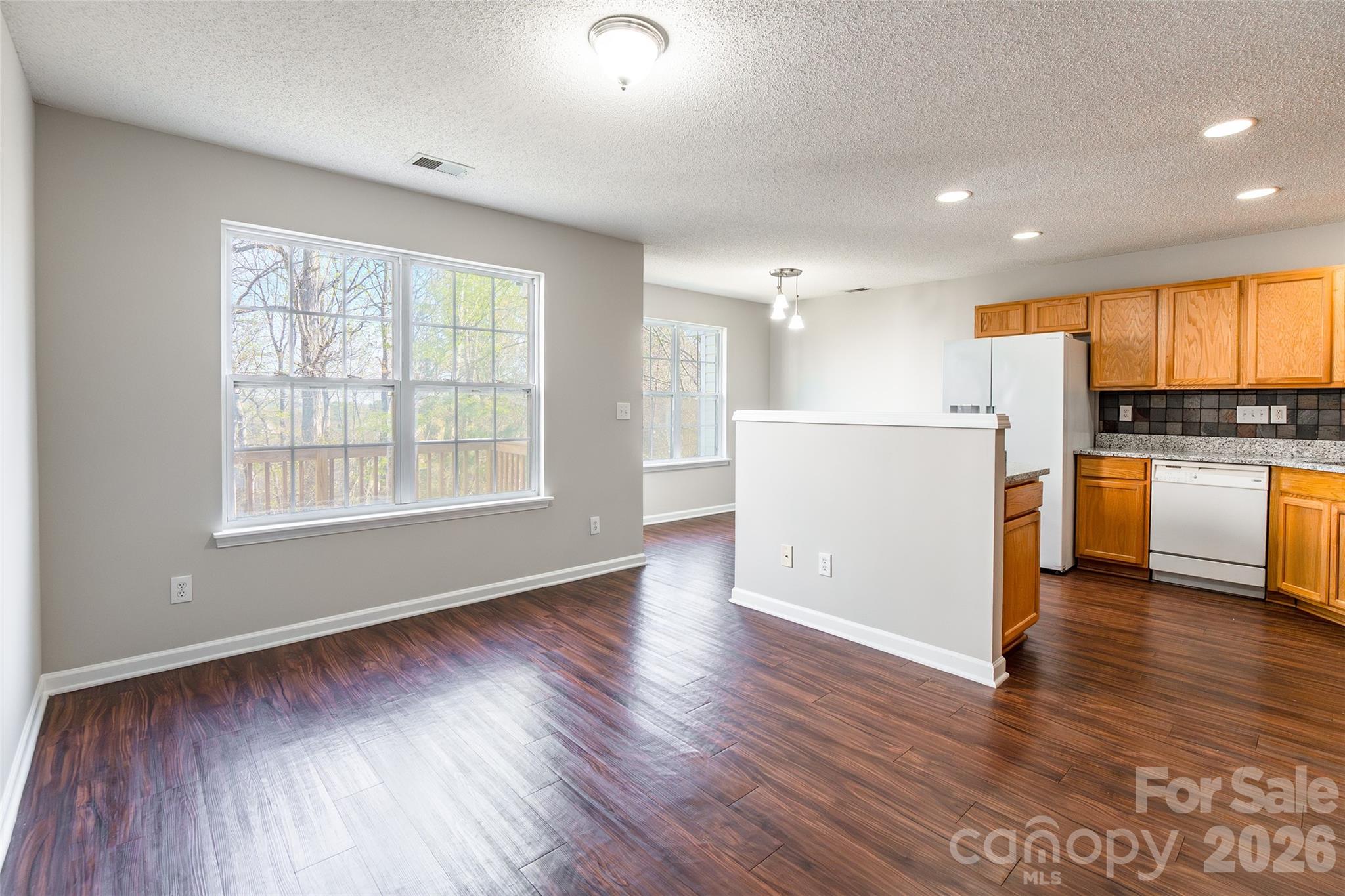 3167 Caldwell Ridge Parkway Charlotte, NC 28213 - Photo 4 of 36 a view of a kitchen with wooden floor and electronic appliances