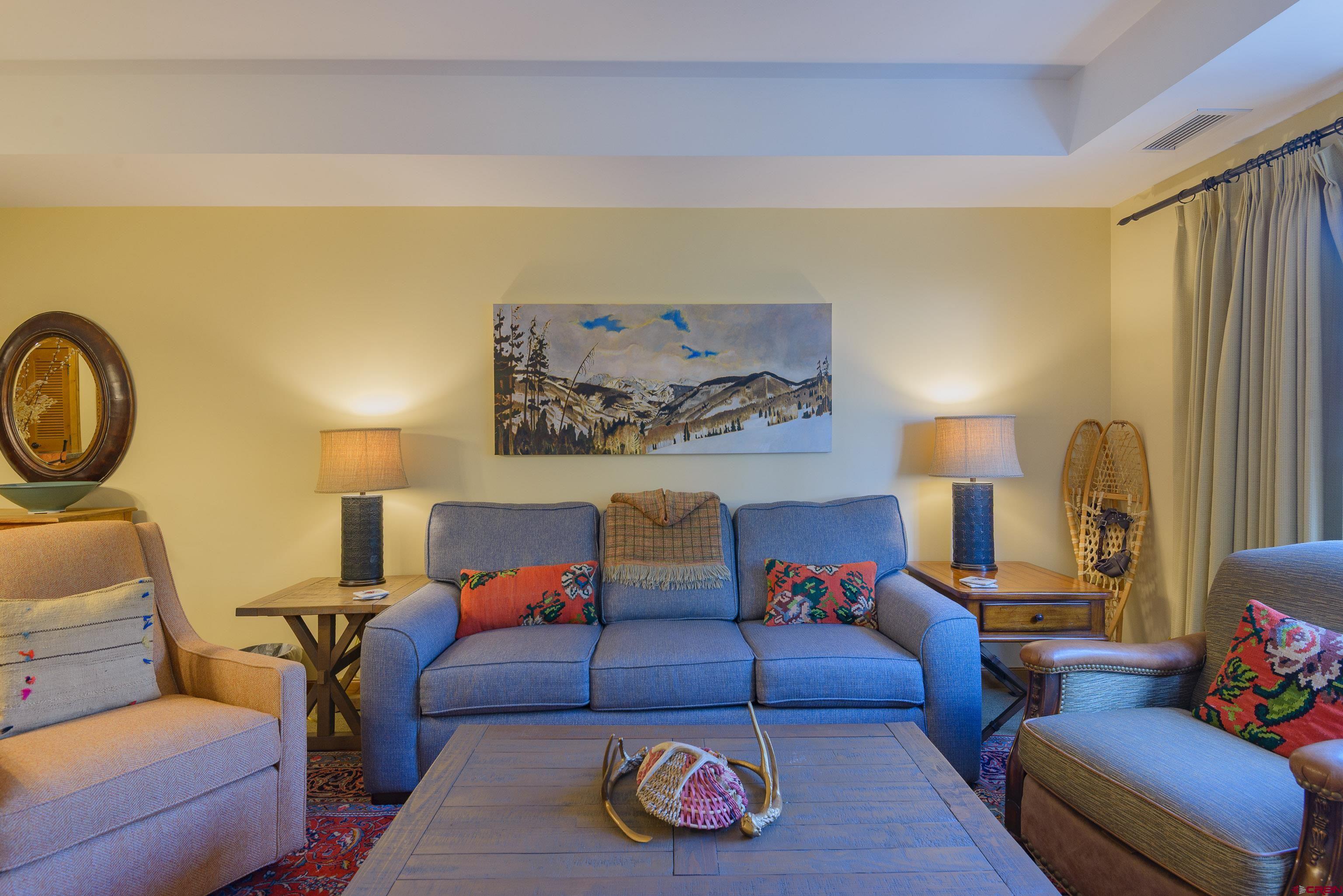 620 Gothic Road, Unit 317 Crested Butte, CO 81225 - Photo 3 of 43 a living room with furniture and a couch