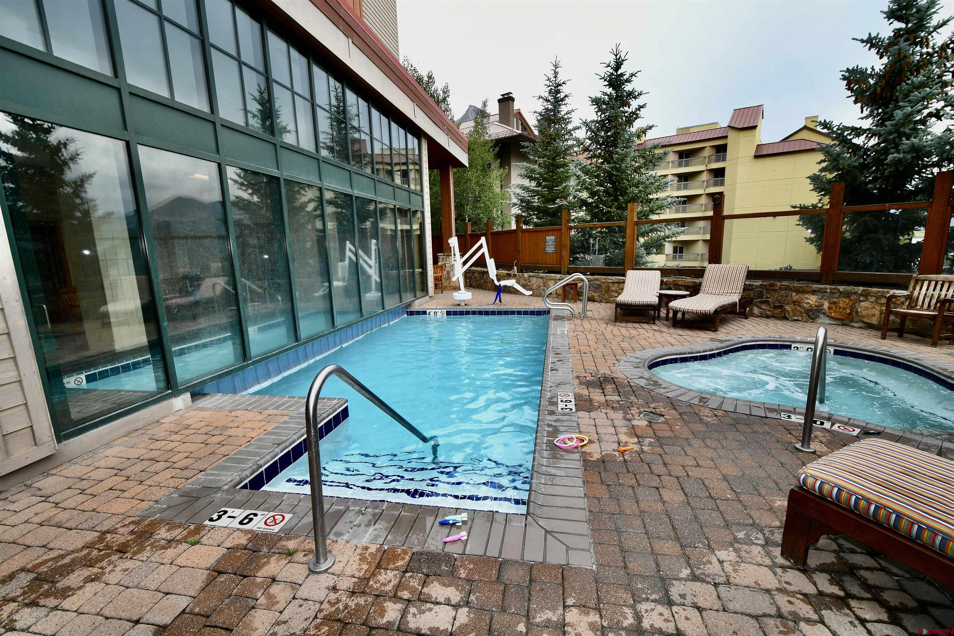 620 Gothic Road, Unit 317 Crested Butte, CO 81225 - Photo 37 of 43 a view of swimming pool with sitting area
