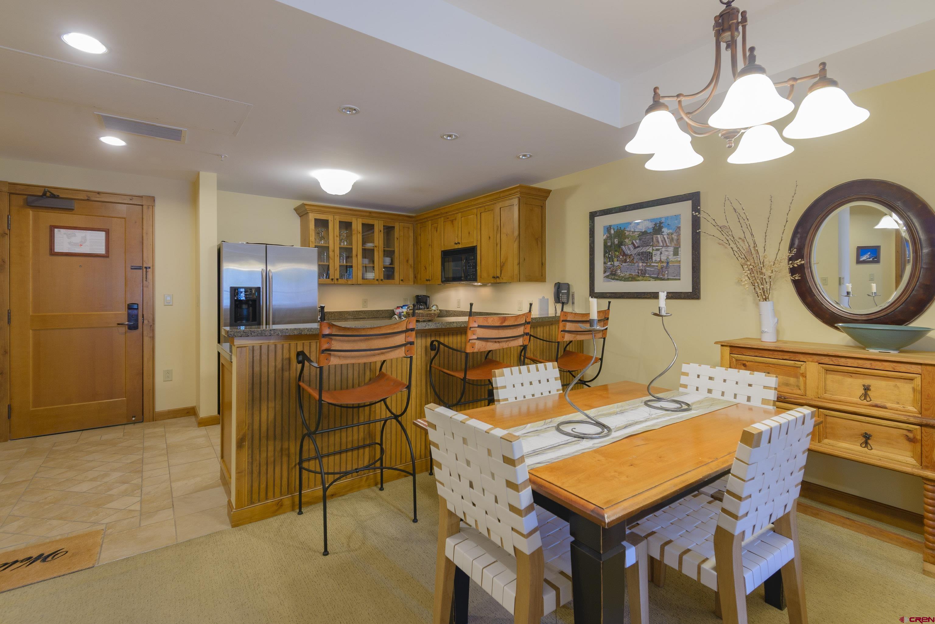 620 Gothic Road, Unit 317 Crested Butte, CO 81225 - Photo 9 of 43 a view of a dining room with furniture
