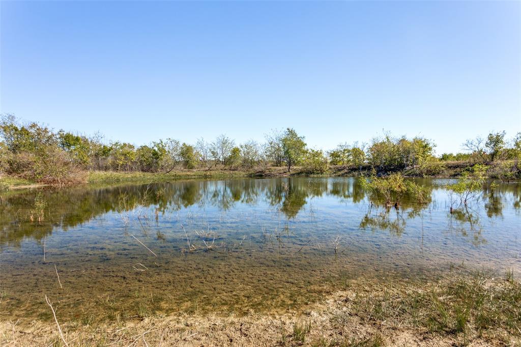 430 Jackson Road Maypearl, TX 76064 - Photo 6 of 6 a view of a lake with houses in the back