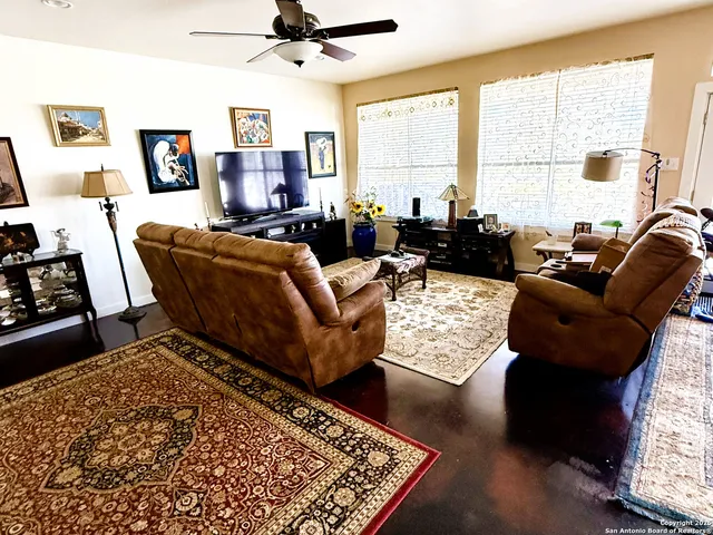 a living room with furniture rug and window