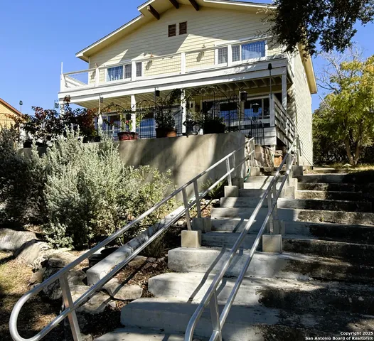 a large building with a pool table and chairs