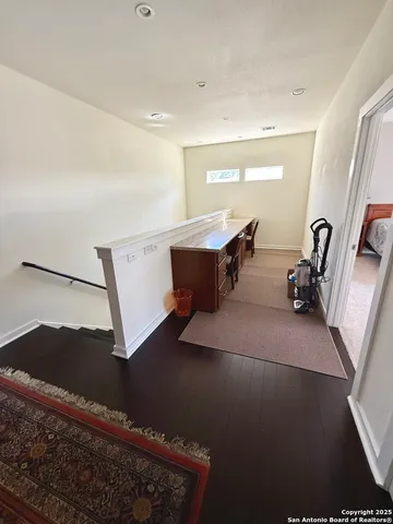 a view of living room with furniture and a window