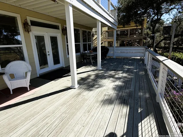 a view of balcony and wooden floor