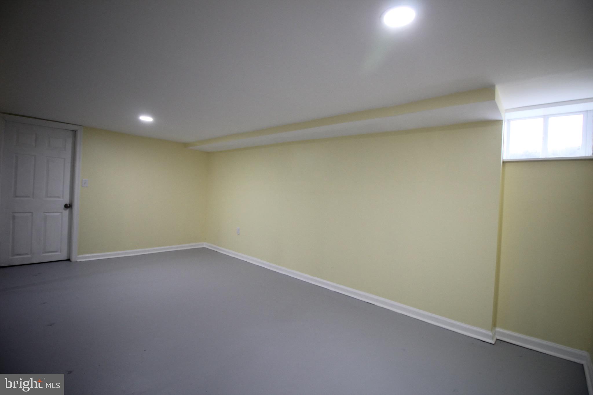 209 Champlain Avenue Wilmington, DE 19804 - Photo 17 of 26 an empty room with a natural light