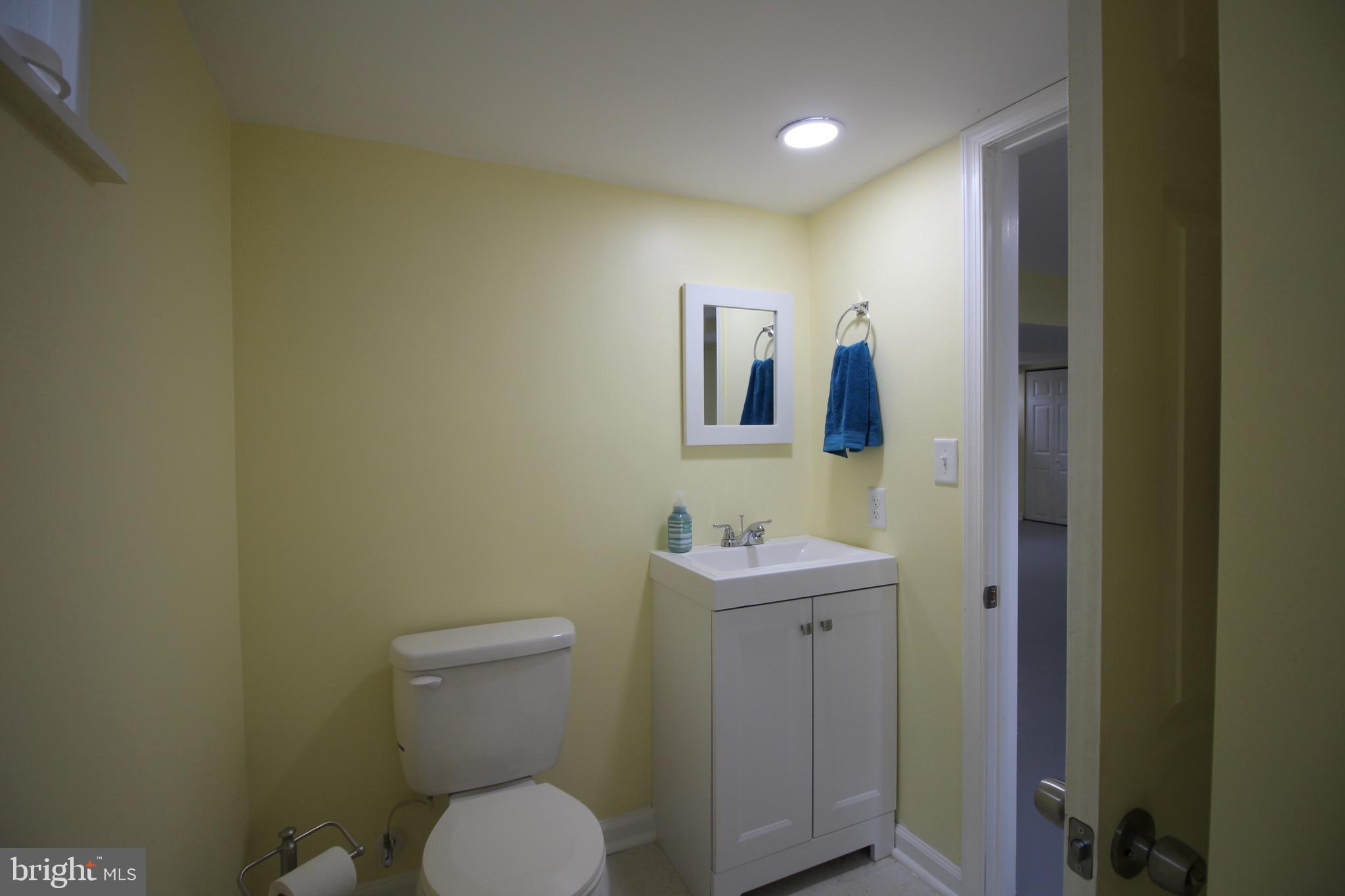 209 Champlain Avenue Wilmington, DE 19804 - Photo 18 of 26 a bathroom with a toilet sink and mirror