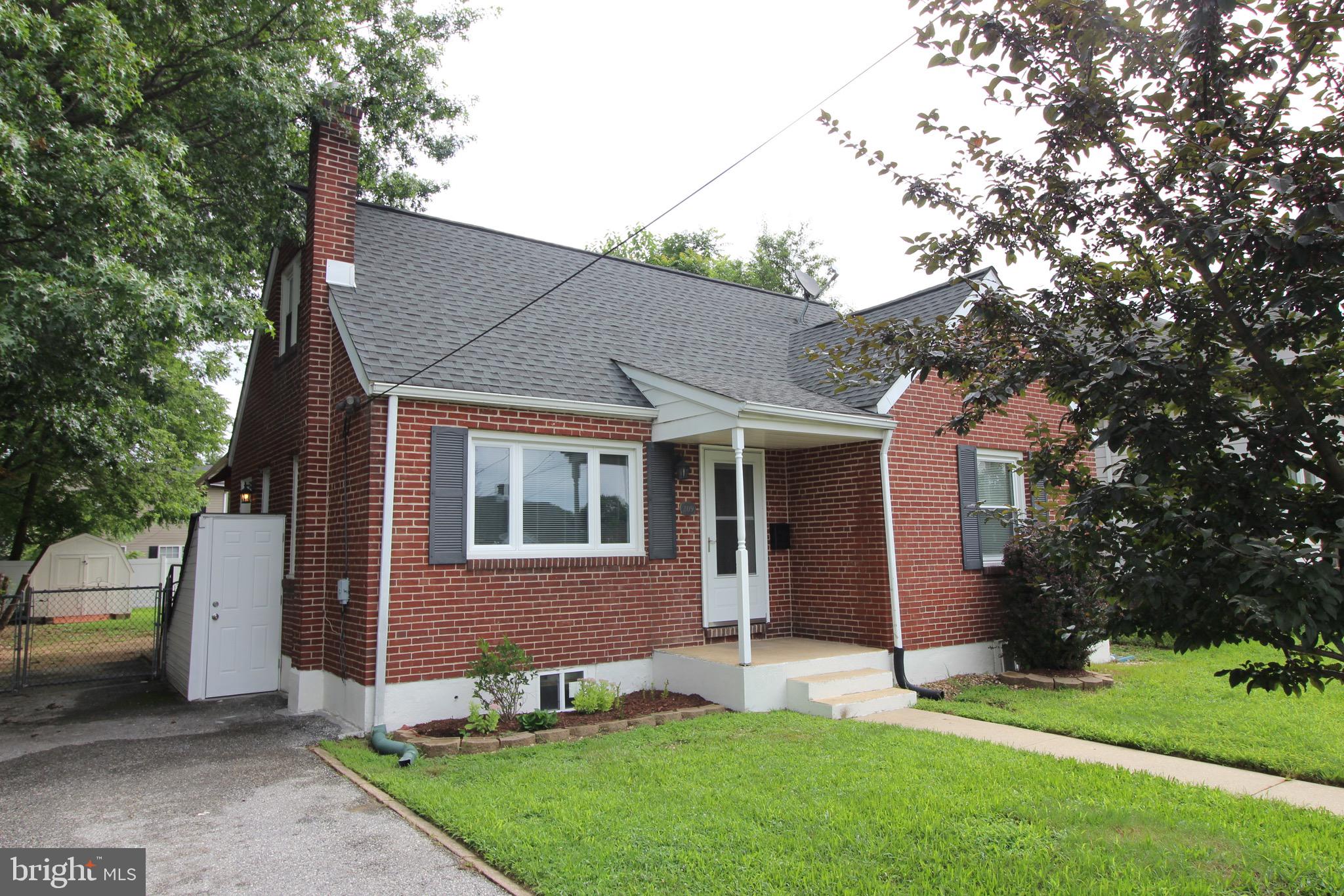 209 Champlain Avenue Wilmington, DE 19804 - Photo 2 of 26 front view of a house with a yard