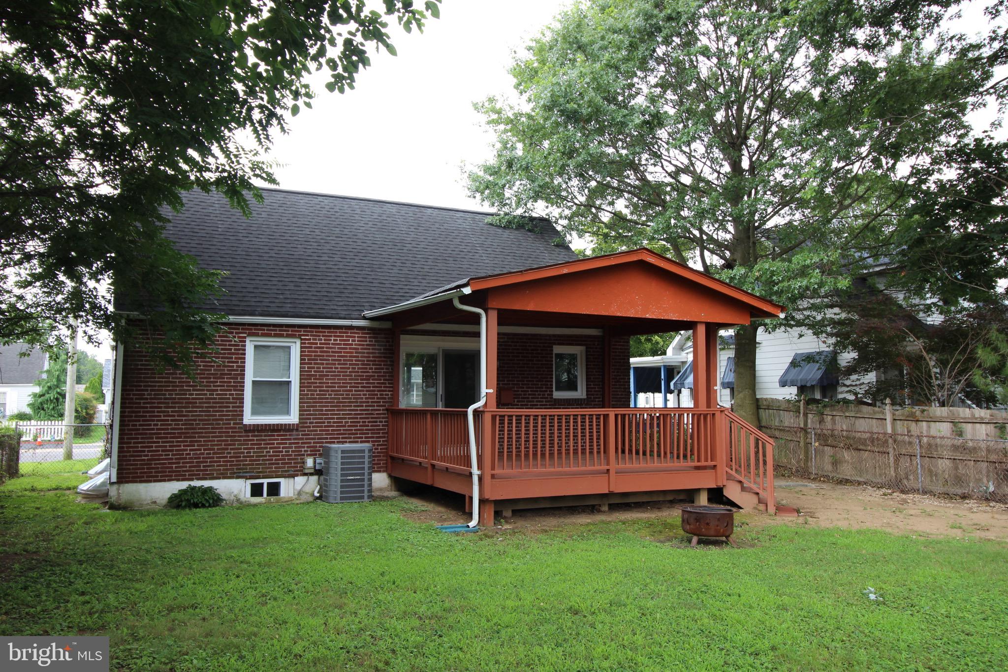 209 Champlain Avenue Wilmington, DE 19804 - Photo 25 of 26 a view of backyard with a garden and deck
