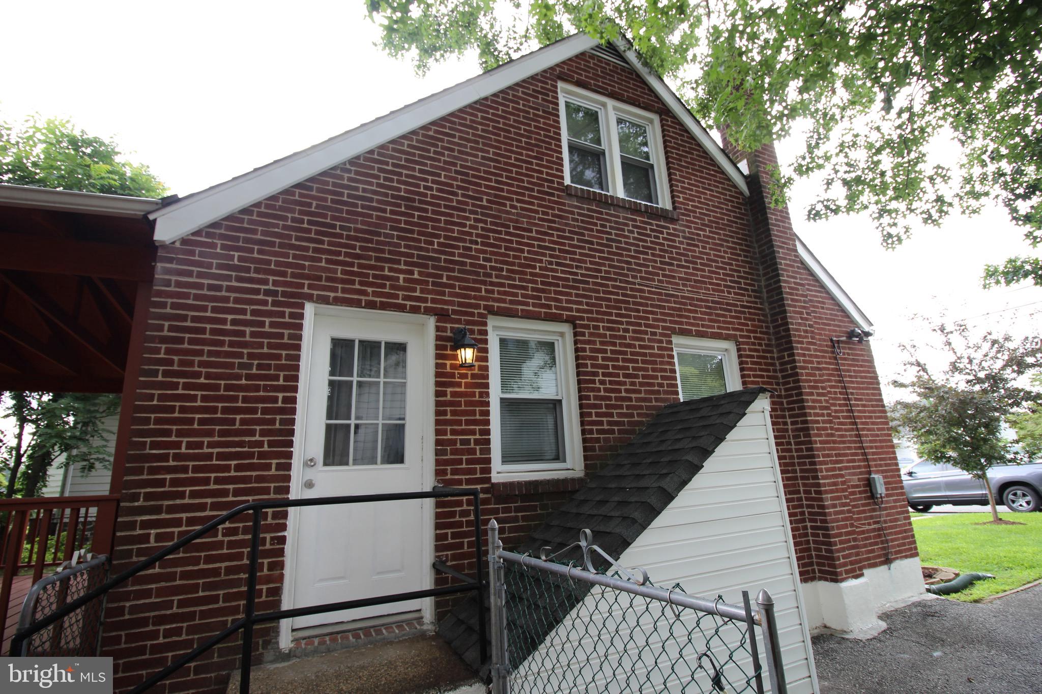 209 Champlain Avenue Wilmington, DE 19804 - Photo 26 of 26 a front view of a house with a garden
