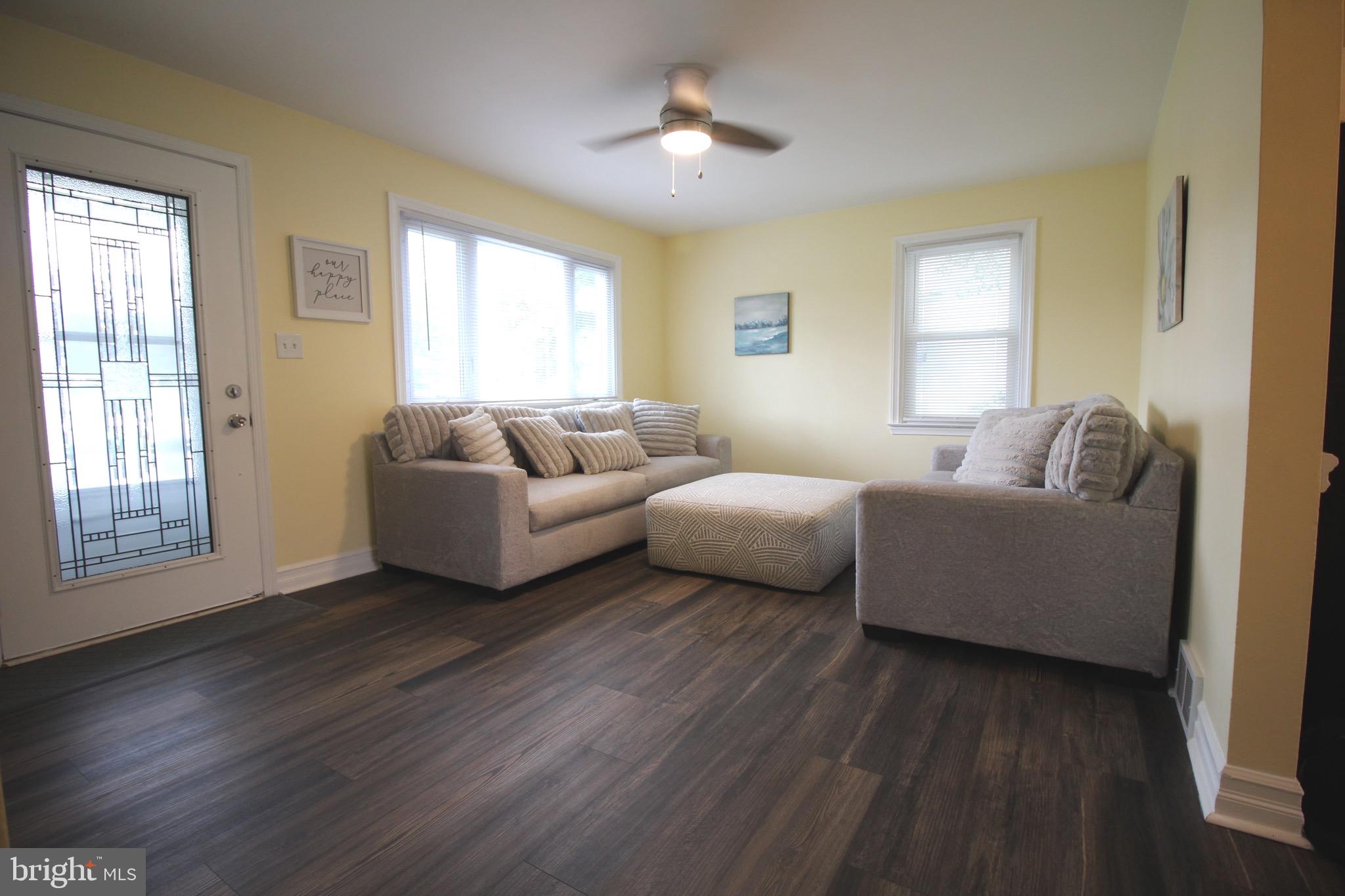 209 Champlain Avenue Wilmington, DE 19804 - Photo 3 of 26 a living room with furniture and a large window