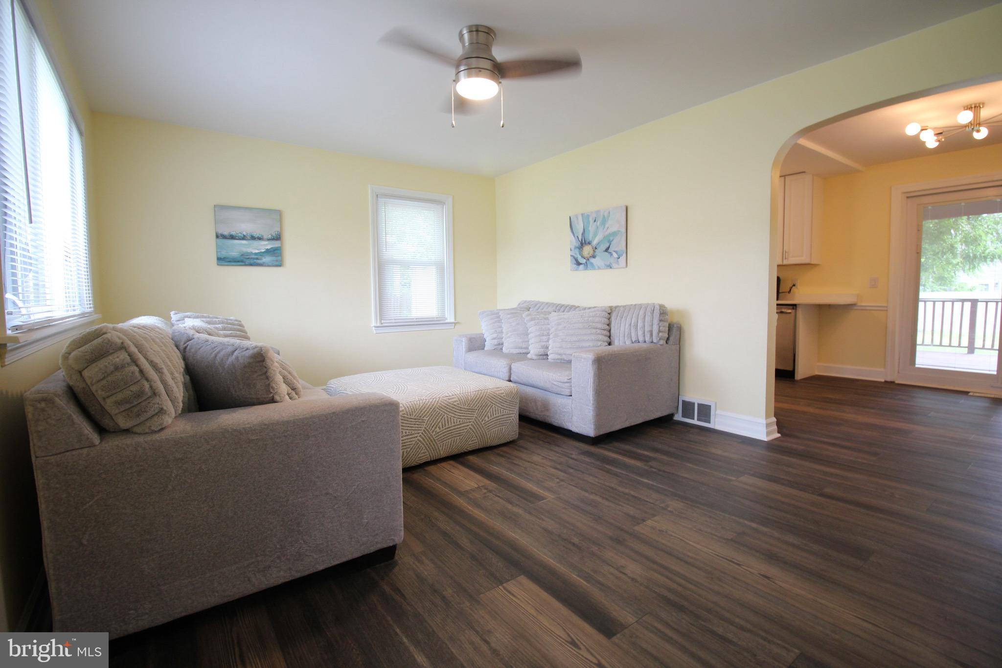 209 Champlain Avenue Wilmington, DE 19804 - Photo 4 of 26 a living room with furniture and a wooden floor
