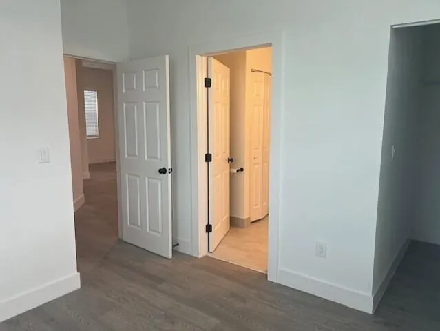 a view of a bathroom from a hallway