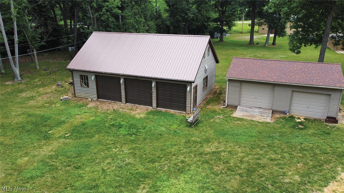 14987 Strader Road East Liverpool, OH 43920 - Photo 2 of 13 View of outdoor structure with a garage and a lawn