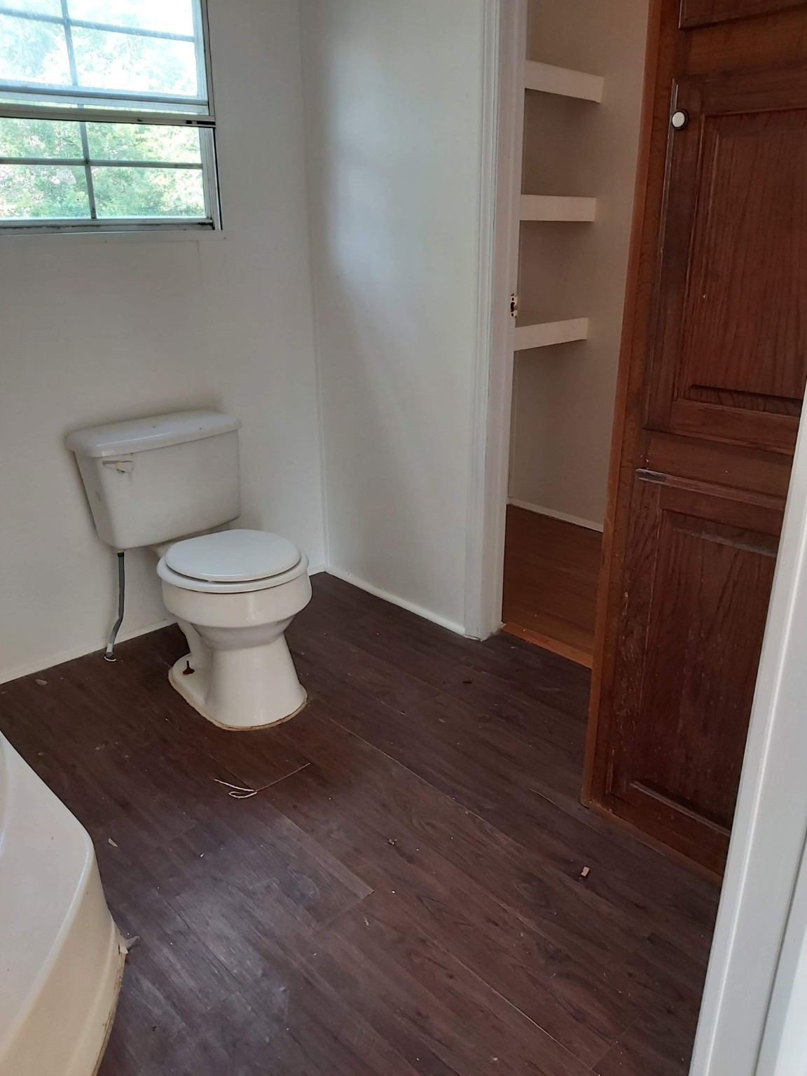 5807 Fletcher Street Crosby, TX 77532 - Photo 16 of 38 a white toilet sitting next to a bathroom sink