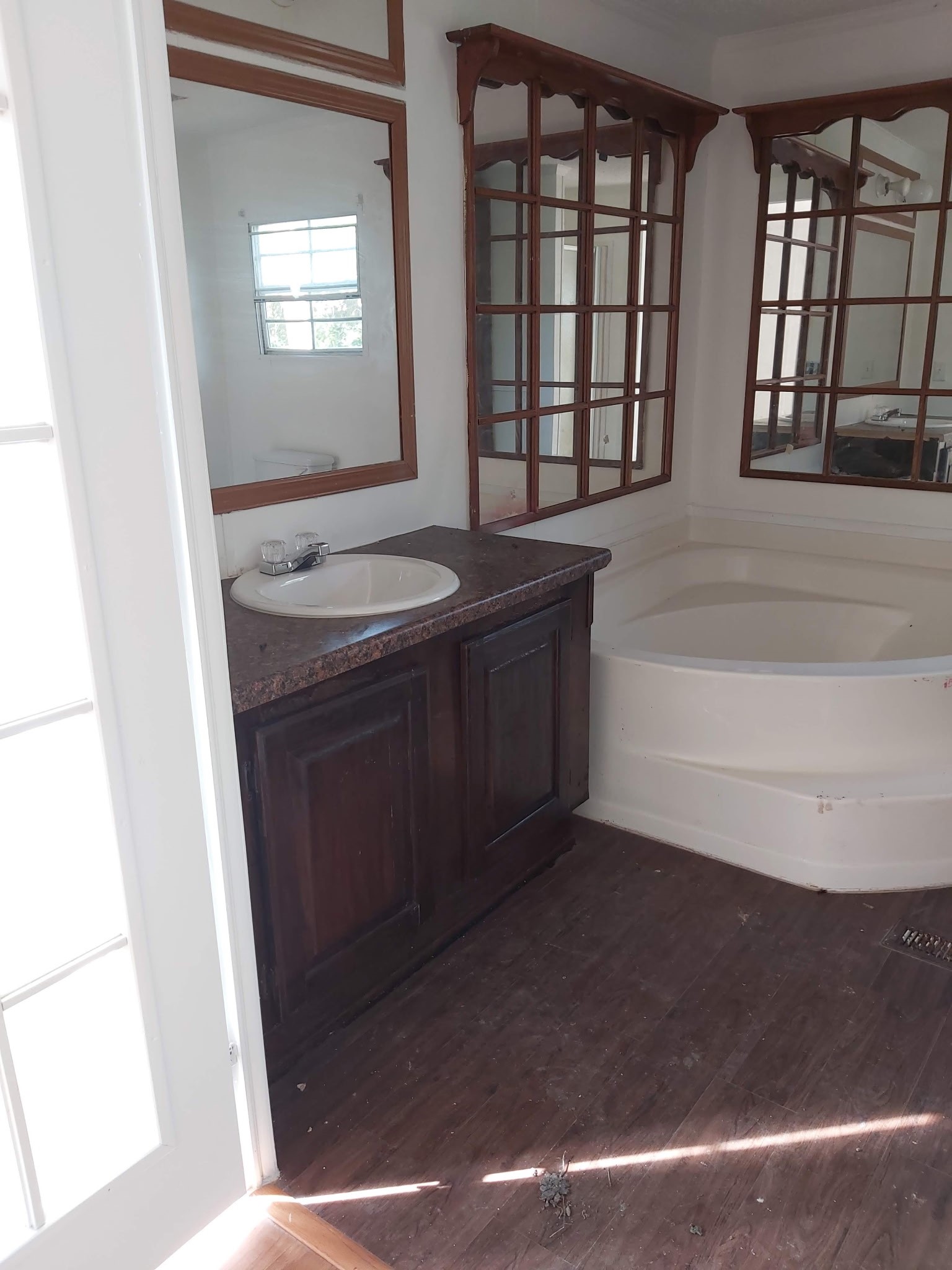 5807 Fletcher Street Crosby, TX 77532 - Photo 17 of 38 a bathroom with a granite countertop sink a toilet and bathtub