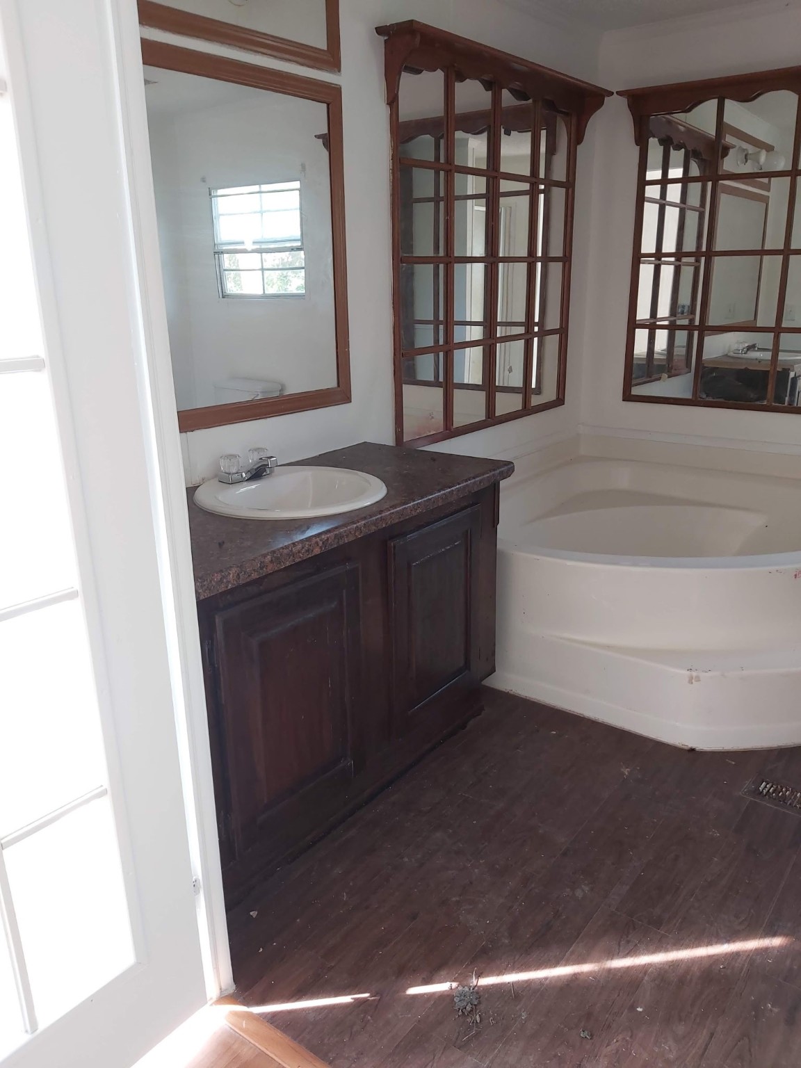 5807 Fletcher Street Crosby, TX 77532 - Photo 17 of 38 a bathroom with a granite countertop sink a toilet and bathtub