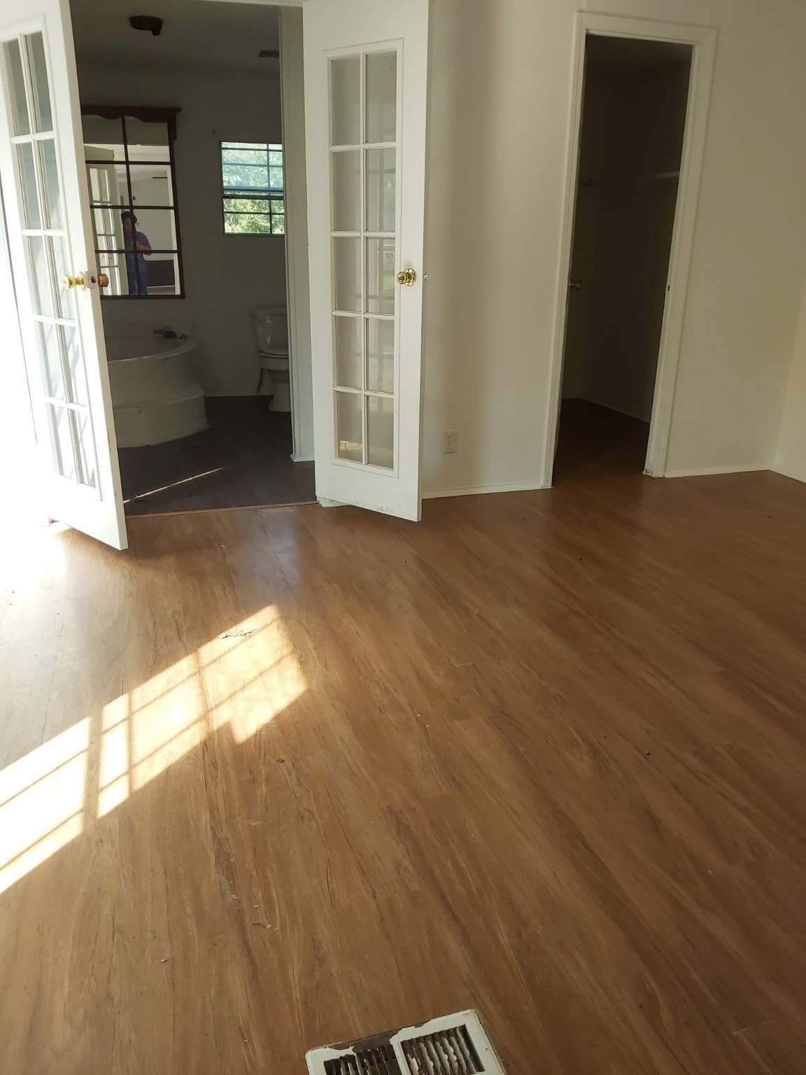 5807 Fletcher Street Crosby, TX 77532 - Photo 19 of 38 an empty room with wooden floor and windows