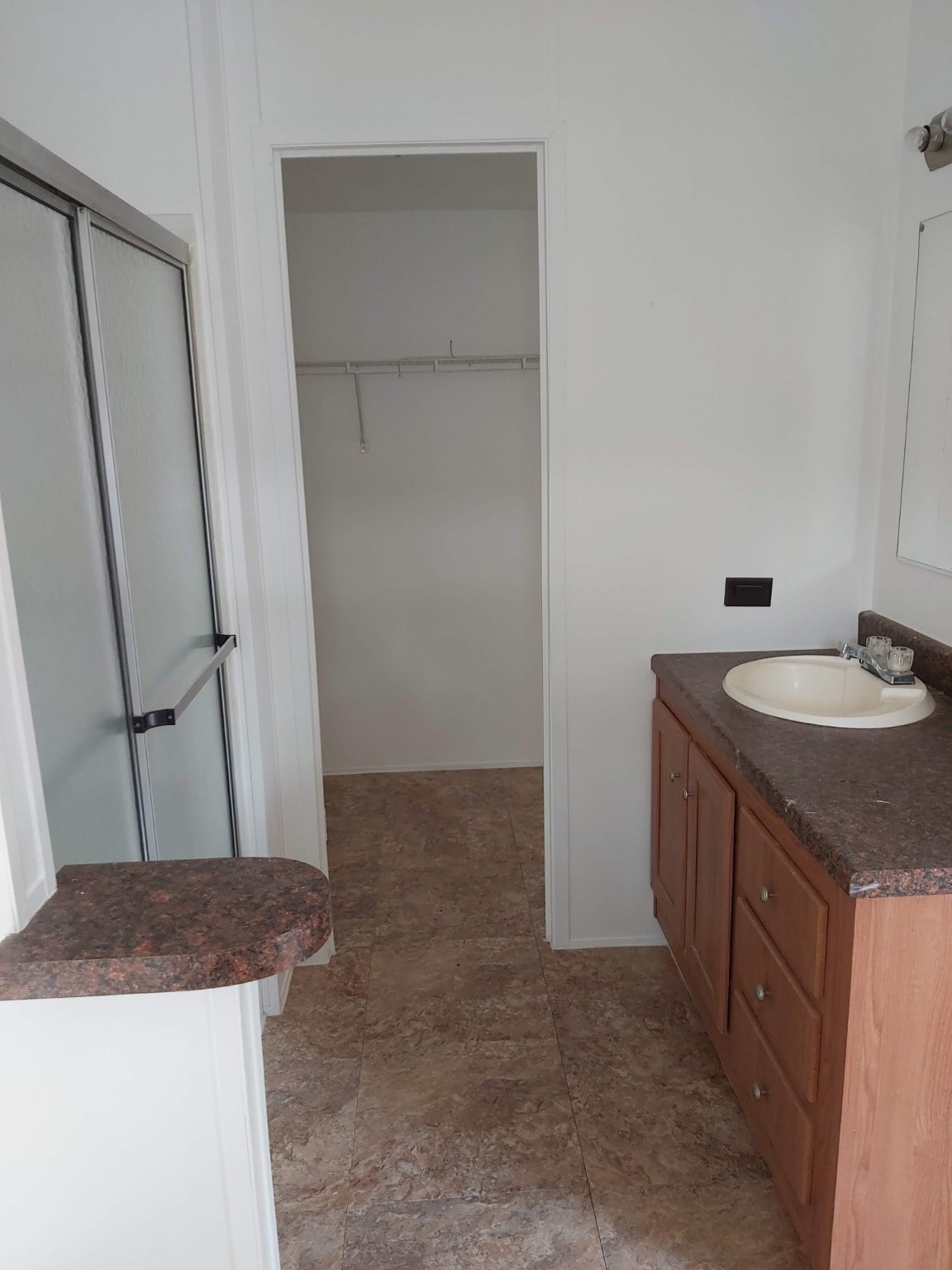 5807 Fletcher Street Crosby, TX 77532 - Photo 23 of 38 a bathroom with a granite countertop sink and a mirror