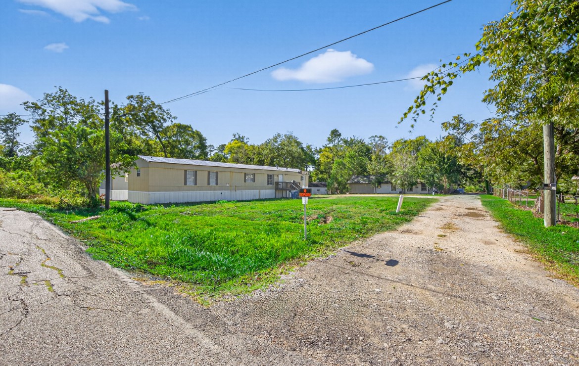 5807 Fletcher Street Crosby, TX 77532 - Photo 4 of 38 front view of a house with a yard