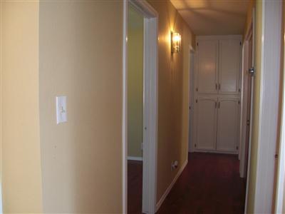1425 West Flora Avenue Reedley, CA 93654 - Photo 13 of 48 Hall, Fresh paint, wood floors, Linen cabinets.