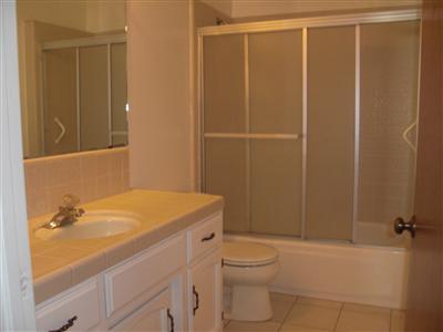1425 West Flora Avenue Reedley, CA 93654 - Photo 14 of 48 Hall bath, Tub and Shower, Tile floor, Tile counter top, fresh paint.