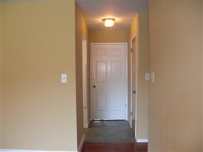 Tile Entry way, freshly painted front door.
