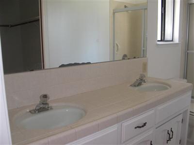 1425 West Flora Avenue Reedley, CA 93654 - Photo 24 of 48 Master bath, Tile and wood floor, tile counter top, double sink, tub and shower, walk in closet.