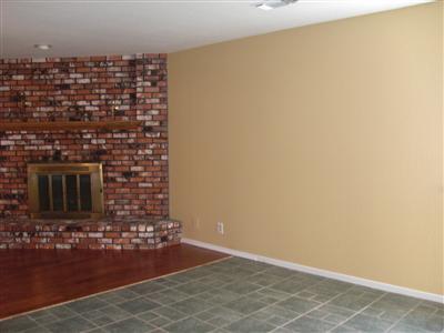 1425 West Flora Avenue Reedley, CA 93654 - Photo 46 of 48 Eating area / Living room. Open floor plan, Brick fireplace. Fresh paint.