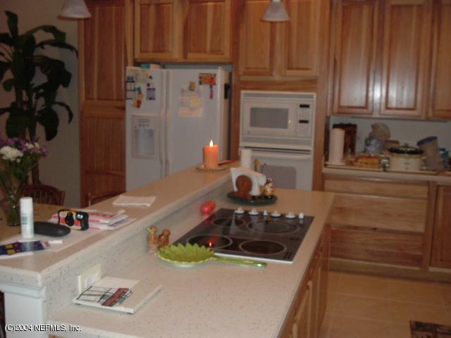 8435 Florence Cove Road St. Augustine, FL 32092 - Photo 11 of 20 a kitchen with a stove and a sink