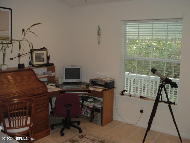 8435 Florence Cove Road St. Augustine, FL 32092 - Photo 18 of 20 a view of a workspace with furniture and a window